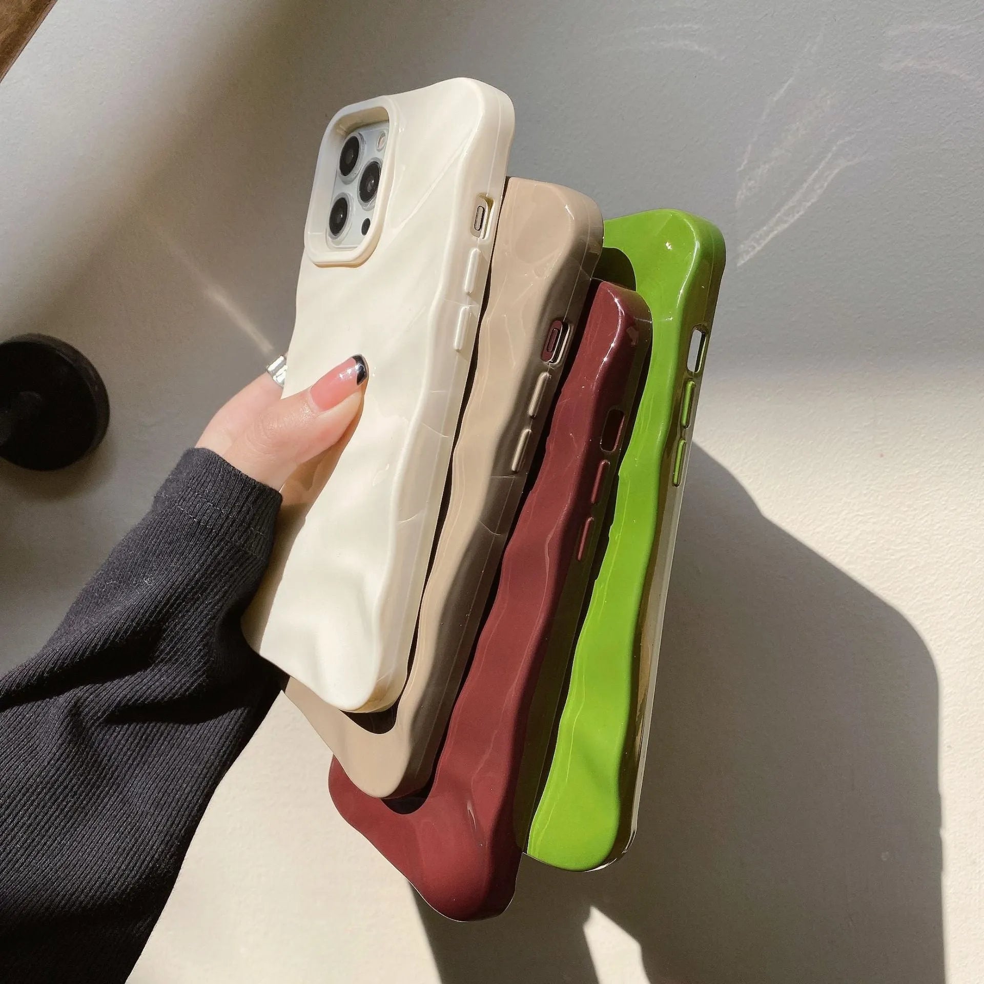 Wave pattern TPU phone case for iPhone 17 series in burgundy colour showing textured back design