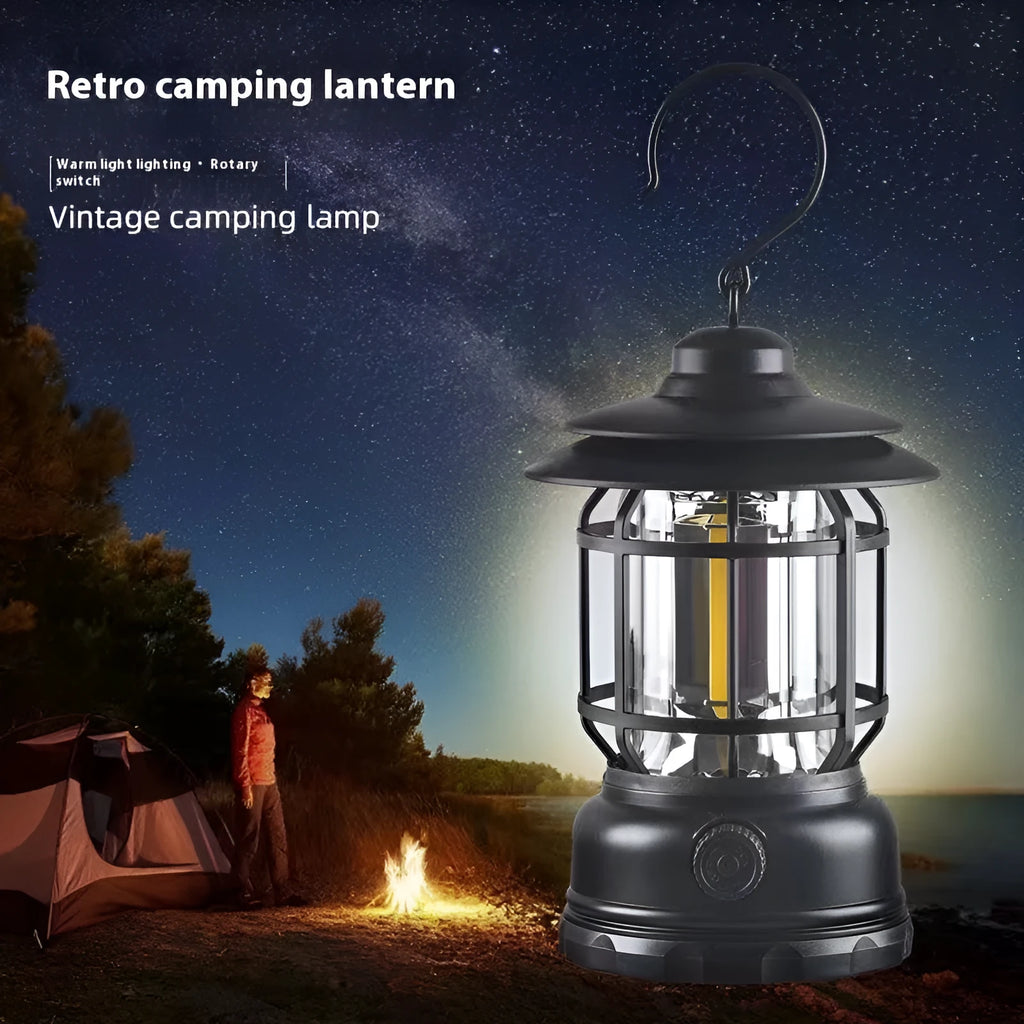 Portable camping lantern in dark green, black, or red colours, showing compact size with battery compartment.