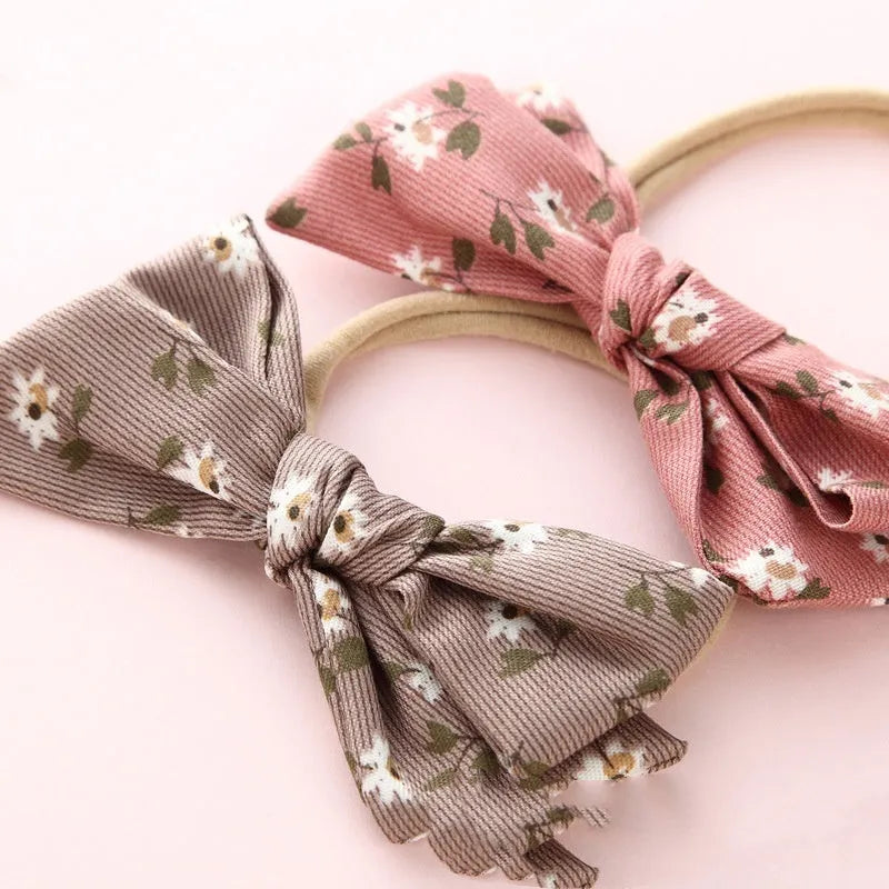 Children's fabric hairband with knotted bow design in multiple colours from Princess series