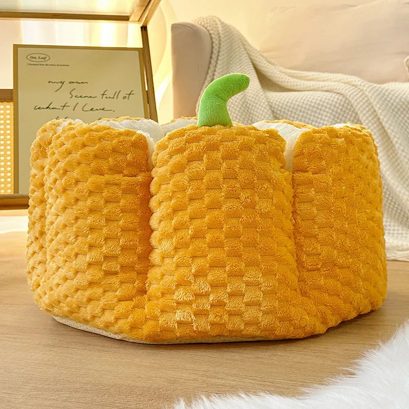 Orange pumpkin-shaped pet bed for cats and small dogs with raised sides and cotton filling