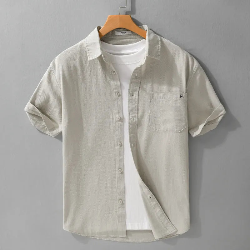 Men's light blue short-sleeved cotton shirt with loose fit and cardigan style for summer wear