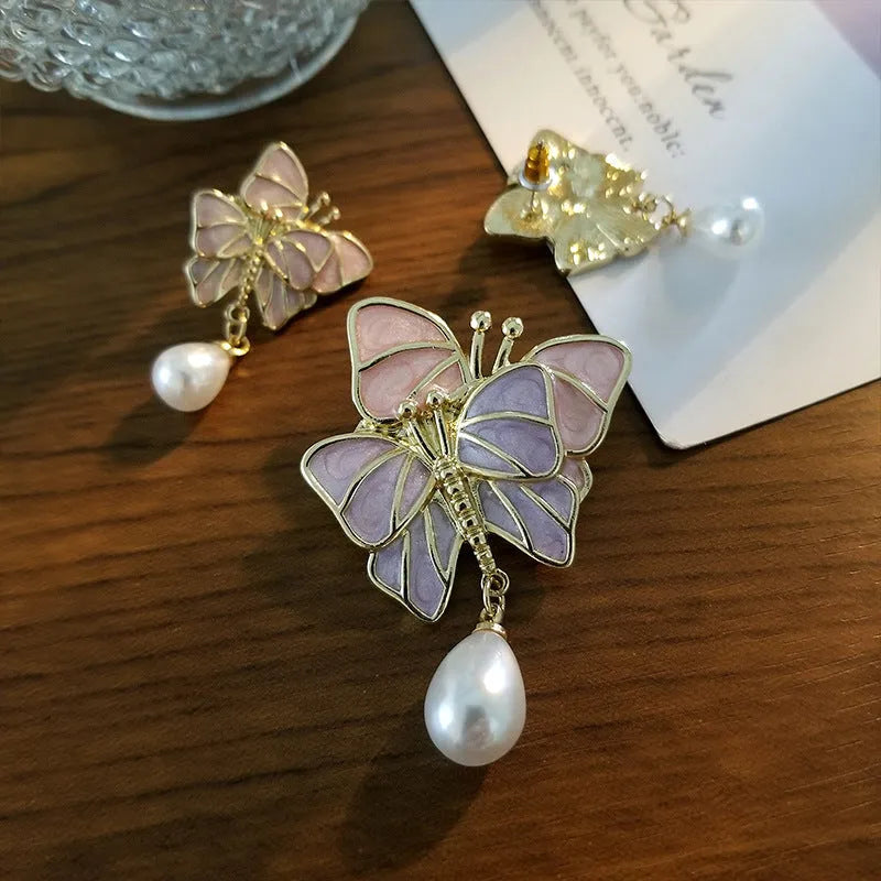 Vintage enamel butterfly brooch with pearl accents on alloy base