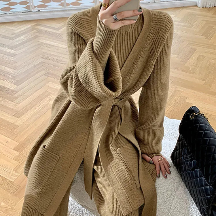 Women's apricot knitted wide-leg pants, sweater, and cardigan three-piece set with leather stitching detail.