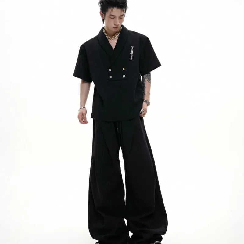 Men's dark grey metal embellished sports suit with V-neck jacket and shorts on a hanger