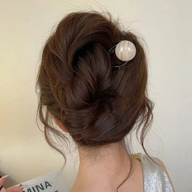 Acrylic U-shaped hair barrettes with ball decoration in beige, caramel, dark grey, and green colours