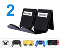 Universal game controller wall mount bracket in black plastic with gaming controller inserted