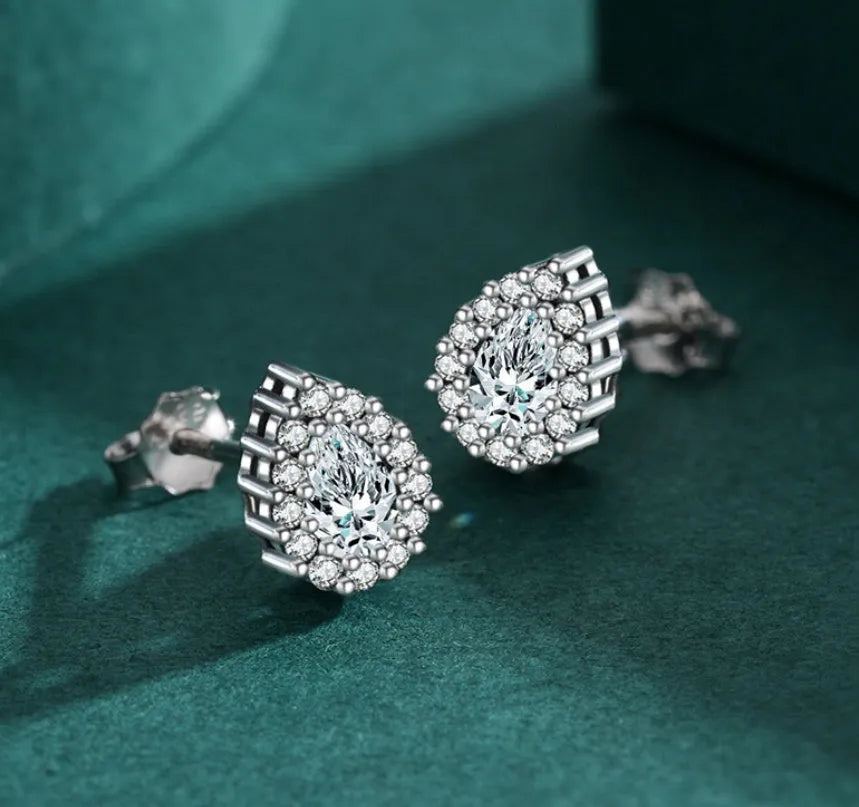 Women's silver drop ear studs in 925 sterling silver with diamond treatment finish