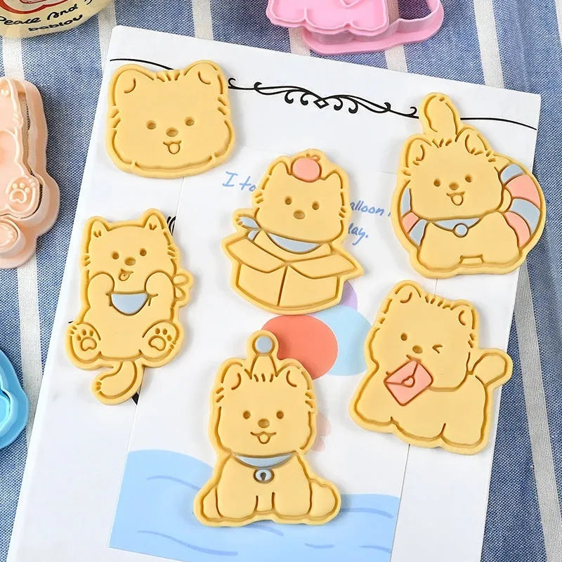 Plastic biscuit mould with puppy head designs including birthday hats and swimming rings