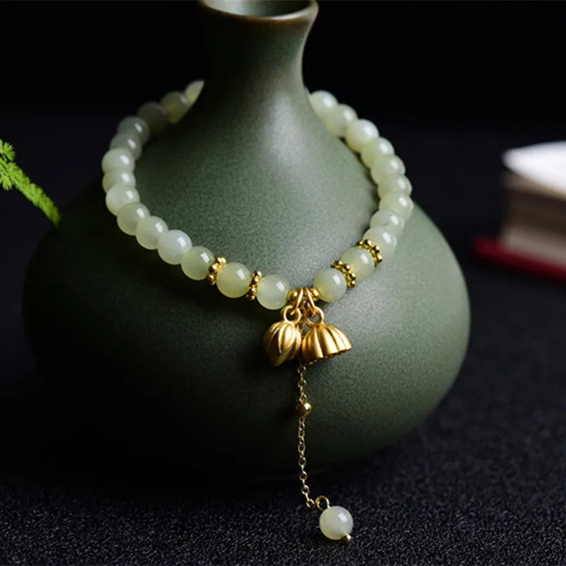 Natural Hetian jade bracelet with 6mm lotus beads and fu character element
