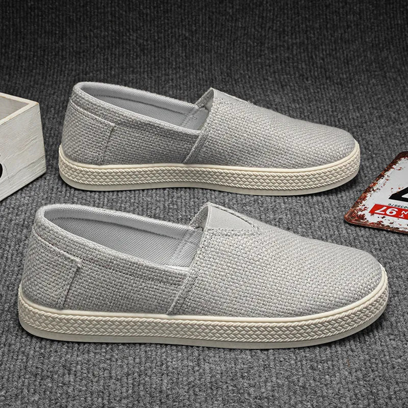 Men's beige canvas shoes with round toe and shallow mouth design on PVC sole