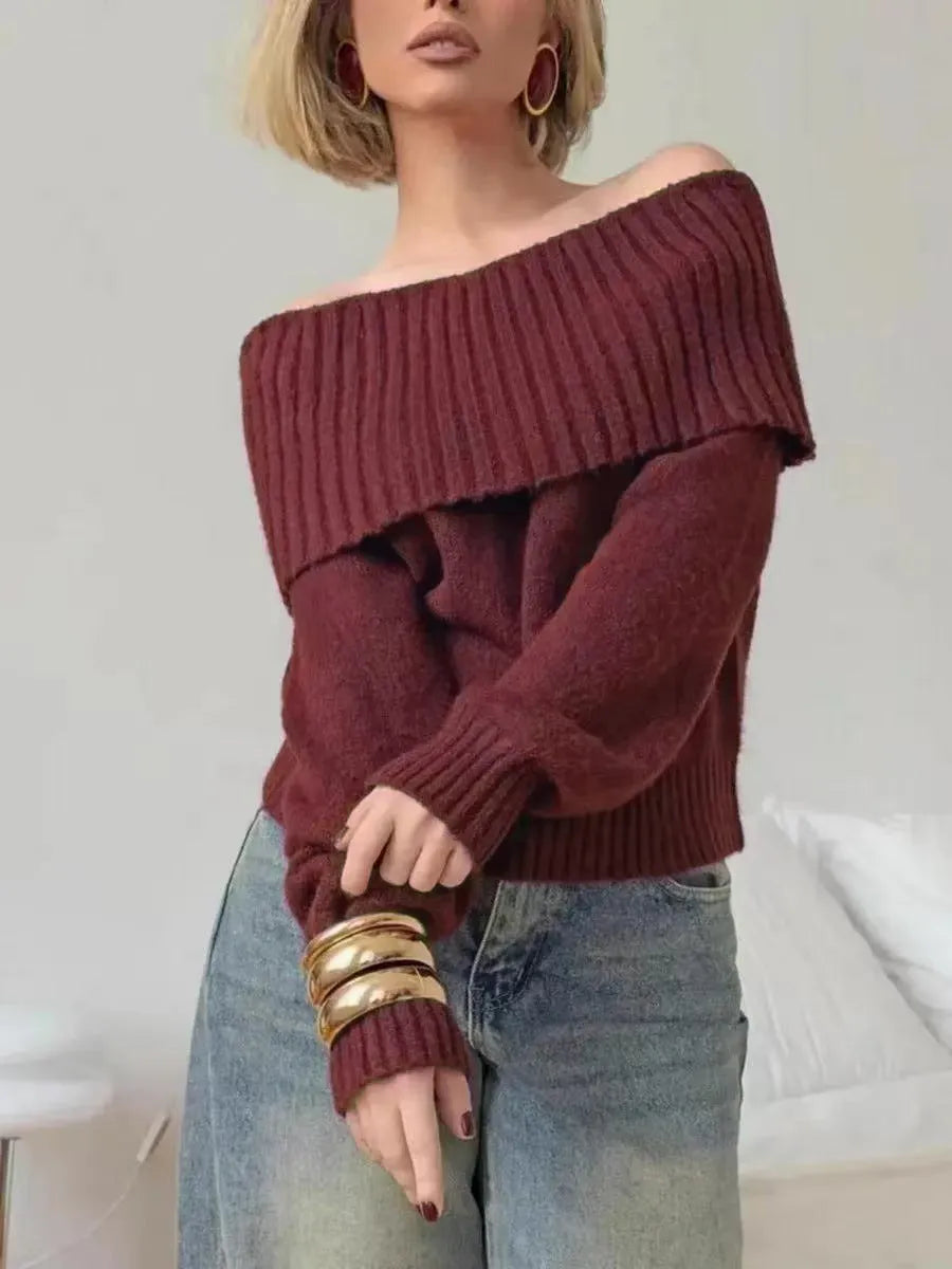 Grey off-the-shoulder strapless sweater with a 3D textured pattern, shown on a model.