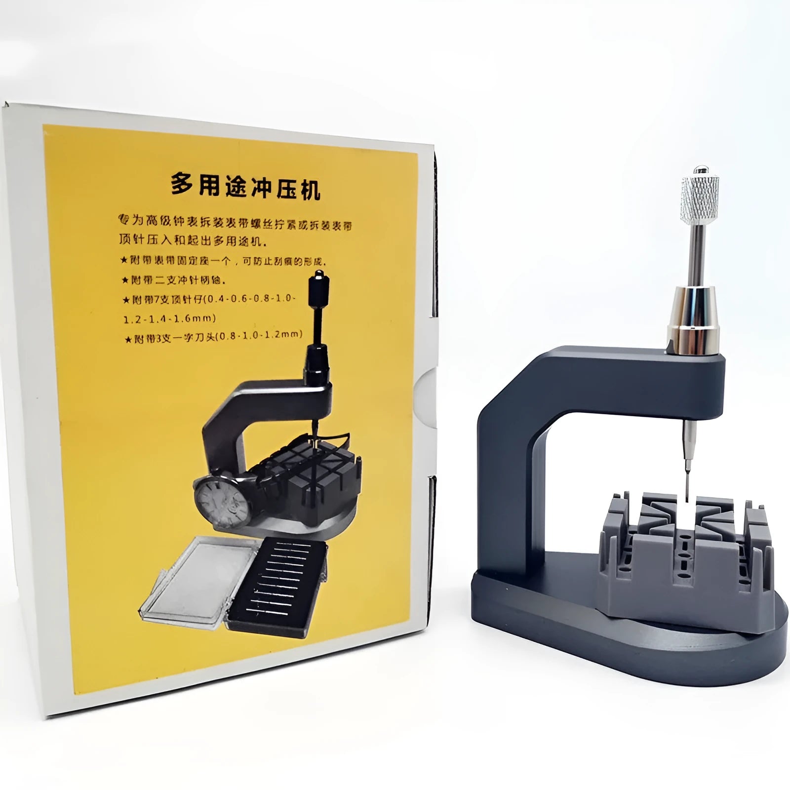 Silver tool steel press strap removal tool for watch and jewellery repair on a workbench.