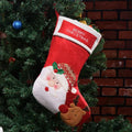 Non-woven fabric Christmas candy bag hanging as a stocking, available in Elk, Old Man, or Snowman print designs.