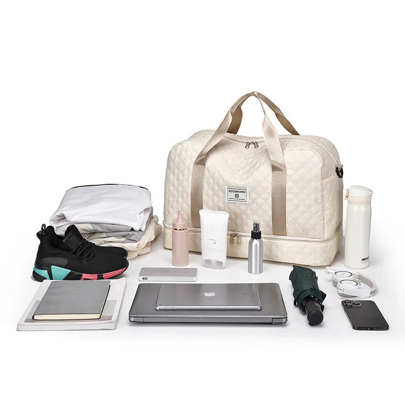 Large 55-litre buggy style travel bag in Oxford cloth, shown in a solid colour with shoulder straps.