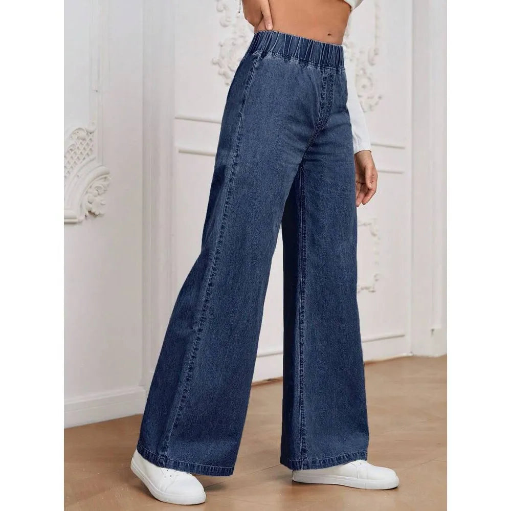 Light blue washed wide-leg straight-cut jeans on a hanger, showing mid-waist and zip fly detail.