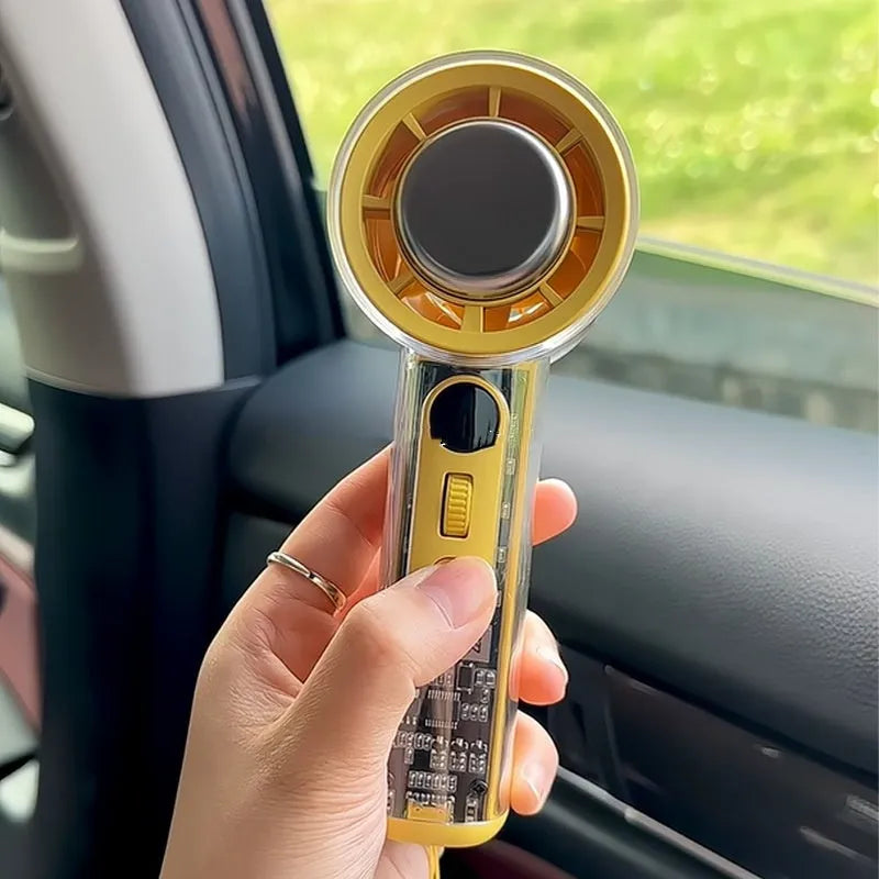 Small yellow handheld portable fan with refrigeration ice compress function showing compact design