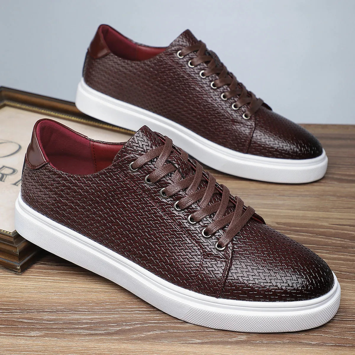 Men's black low-top business leather shoes with a rubber sole and stitching detail.