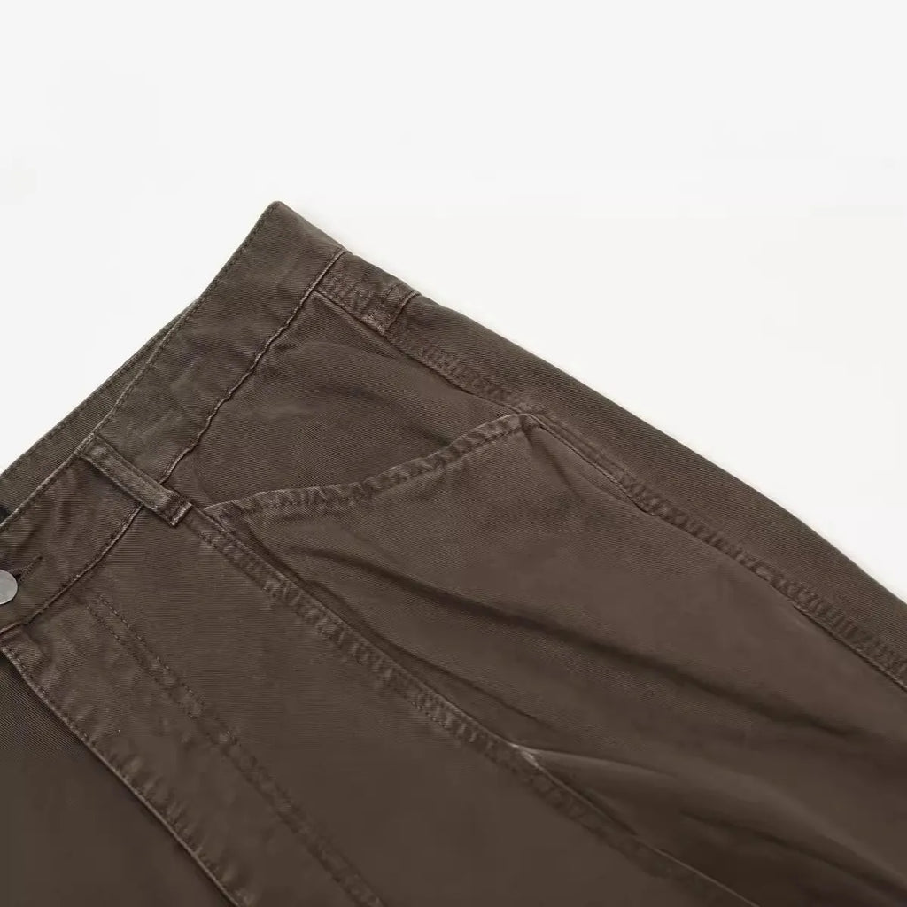 Men's brown loose straight leg jeans with high waist design and zip fly closure