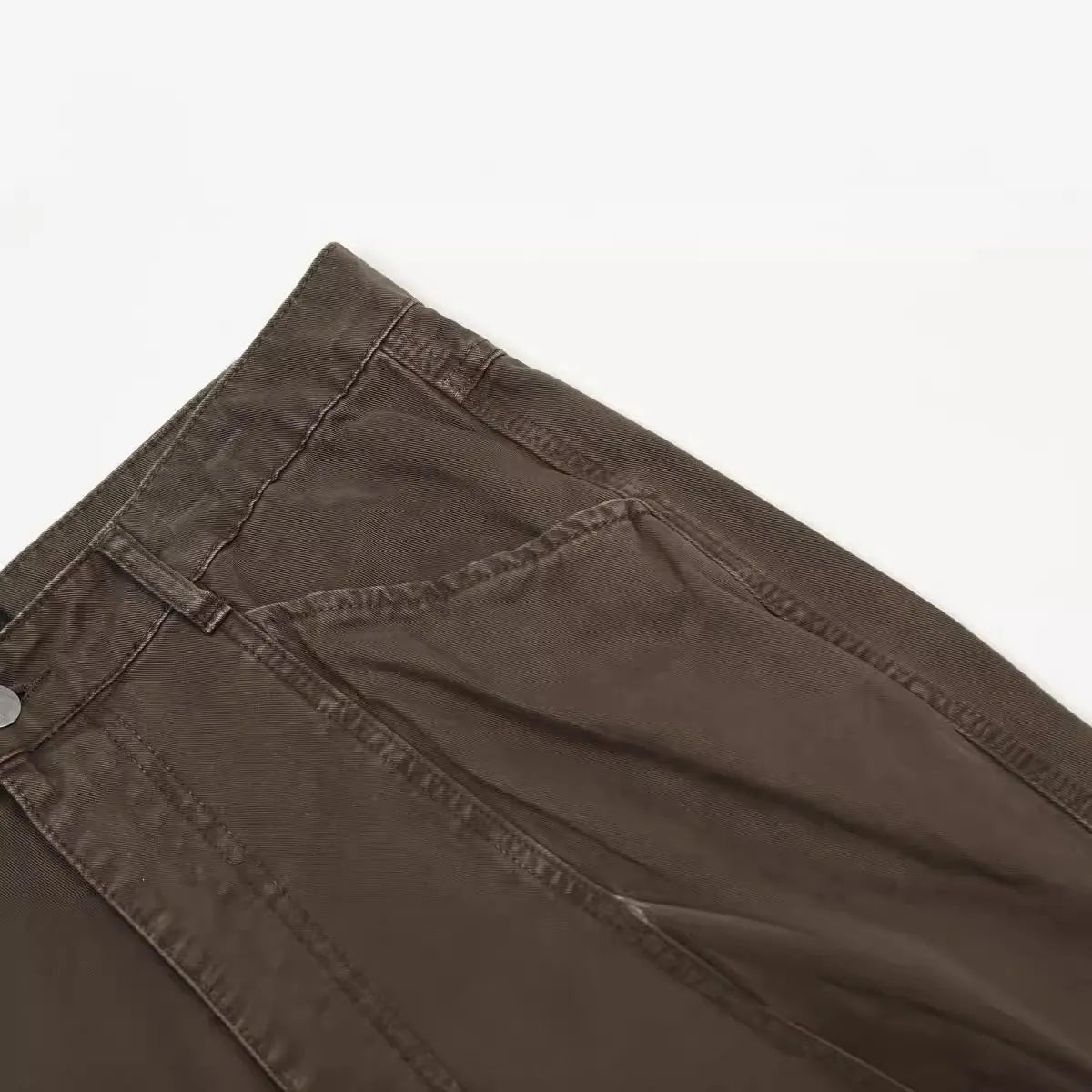 Men's brown loose straight leg jeans with high waist design and zip fly closure