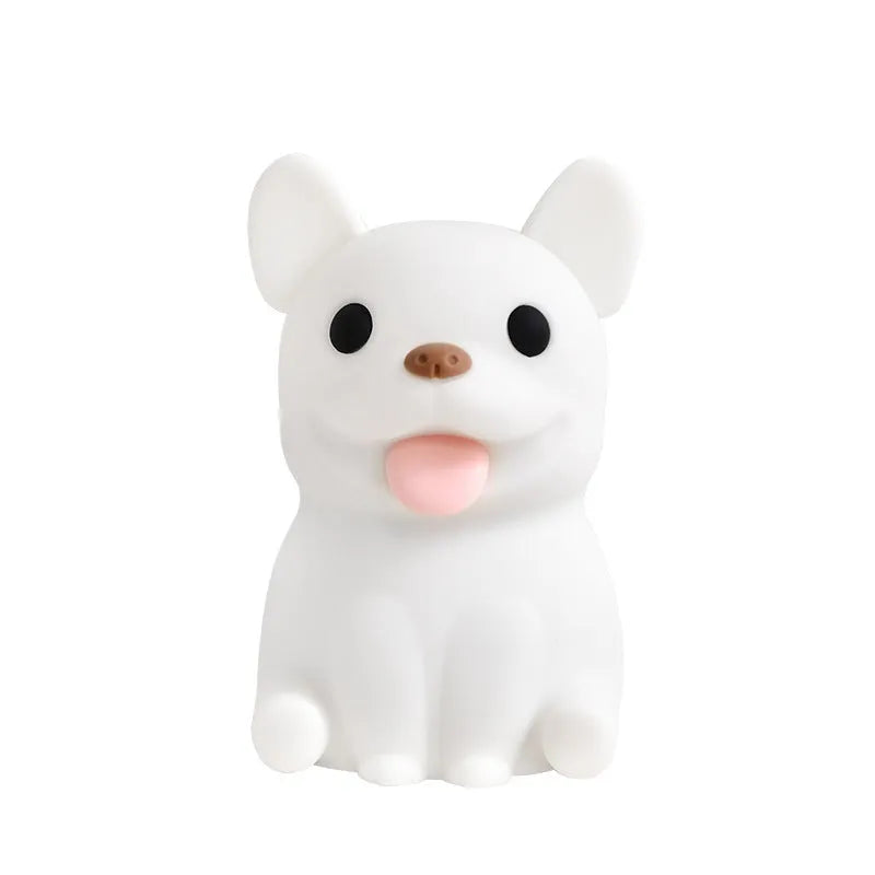Cartoon animal silicone USB night light with dimmer switch on a bedside table.