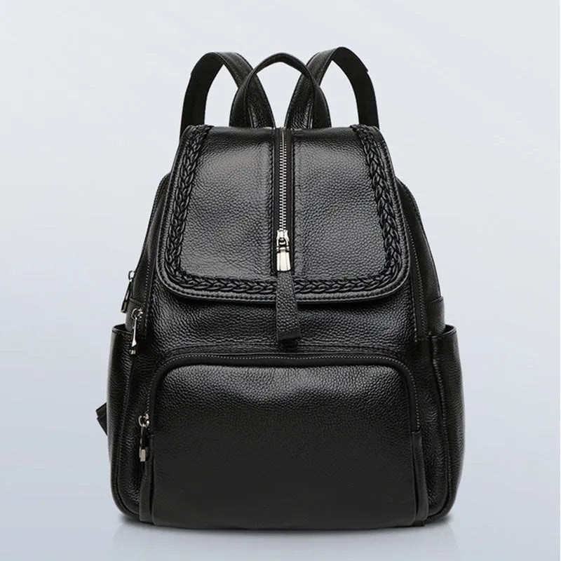 Solid colour genuine leather women's backpack showing internal organisation compartments
