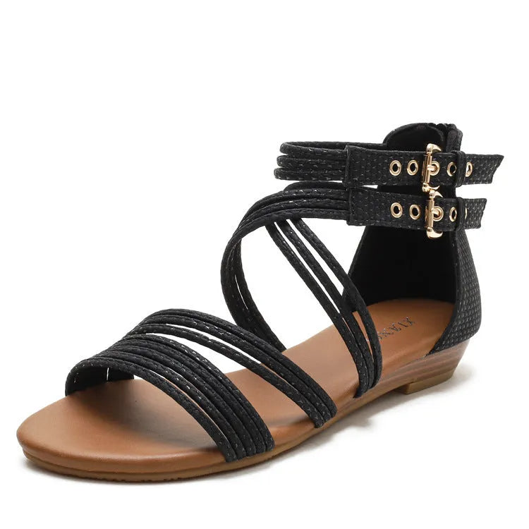 Women's black open-toe Roman sandals with cross straps, wedge heel, and back zipper.