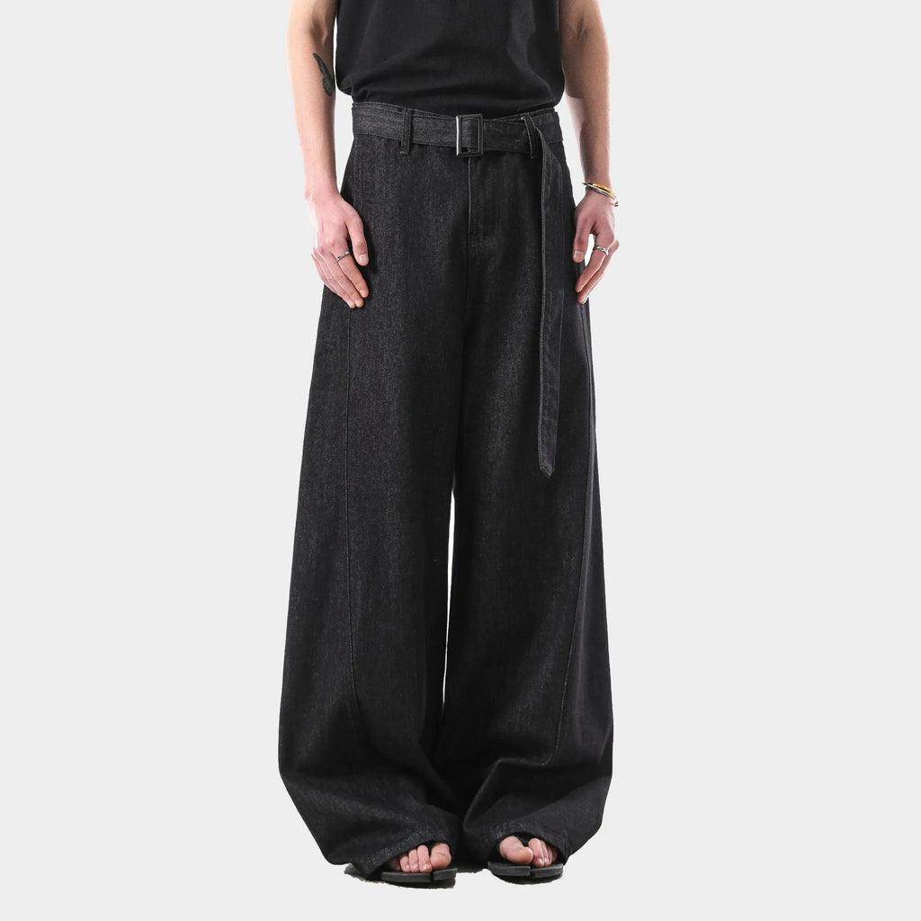 Black women's high waist straight leg jeans with gold detailing and a zip fly.