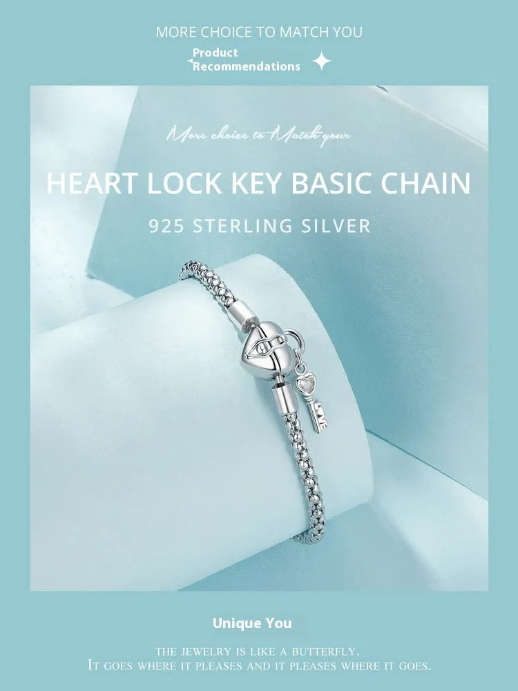 925 silver heart lock key bracelet with electroplated finish on neutral background