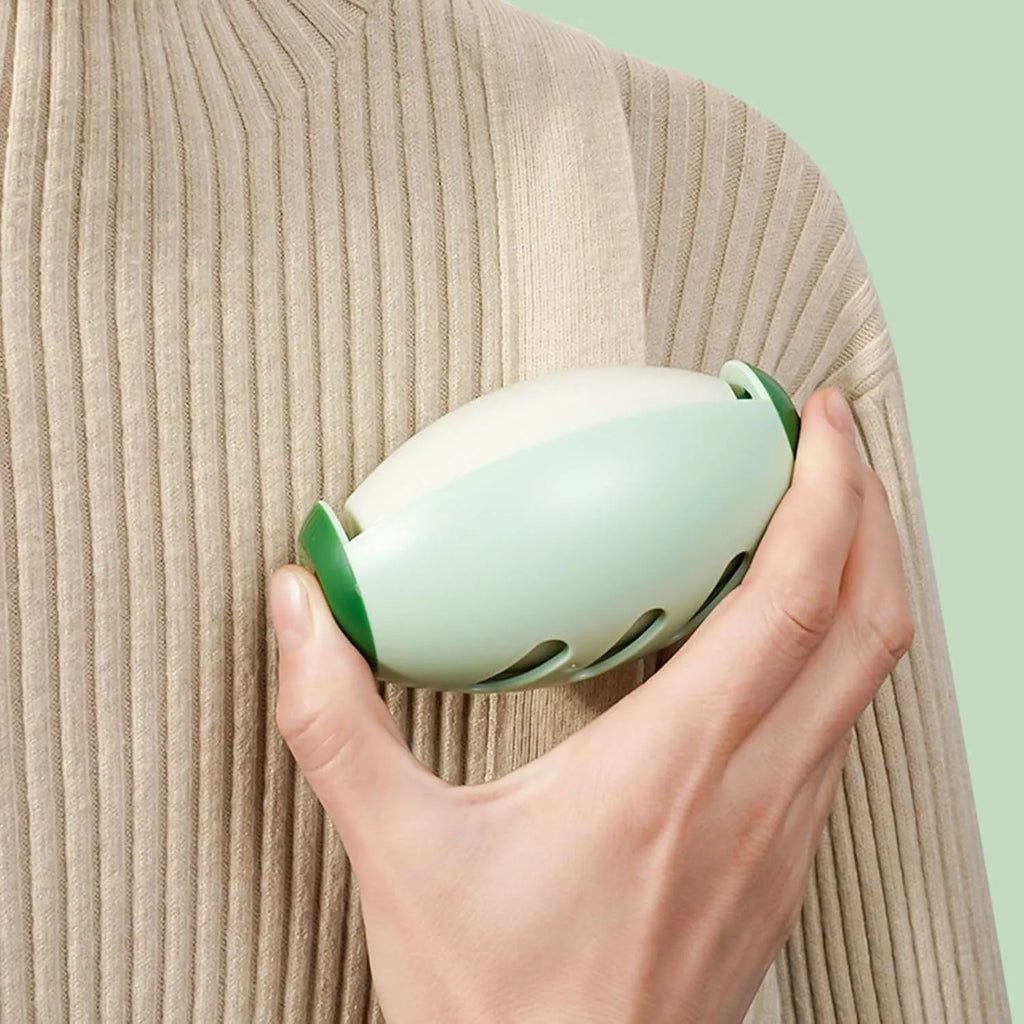 Green and white washable reusable gel lint roller ball for pet hair removal.