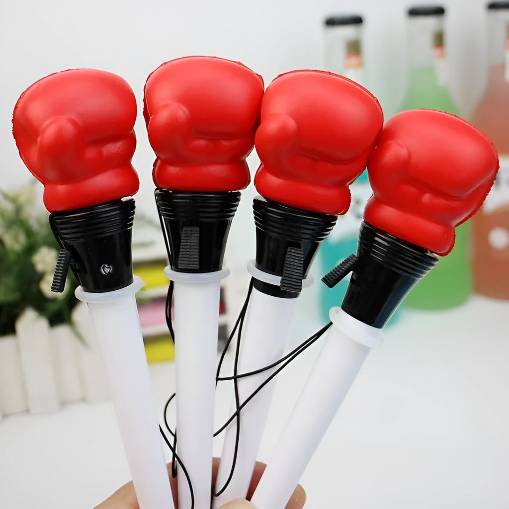 Four black gel pens with pressure relief boxing press ejection mechanisms