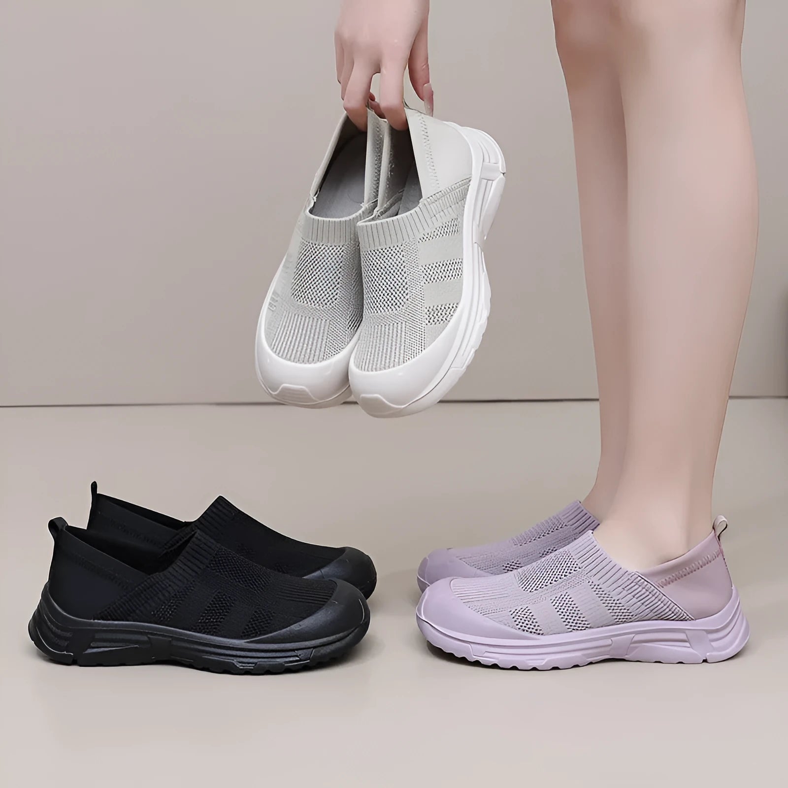 Women's black slip-on shoes with cloth upper and PVC sole in round-toe design
