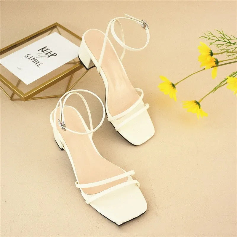 Beige women's square-toe sandals with a stiletto chunky heel and ankle buckle.