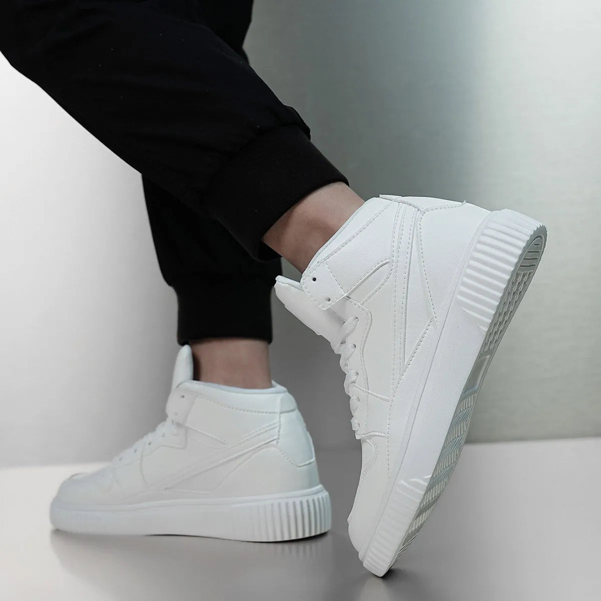 Men's white microfiber leather casual shoes with round toe design on neutral background