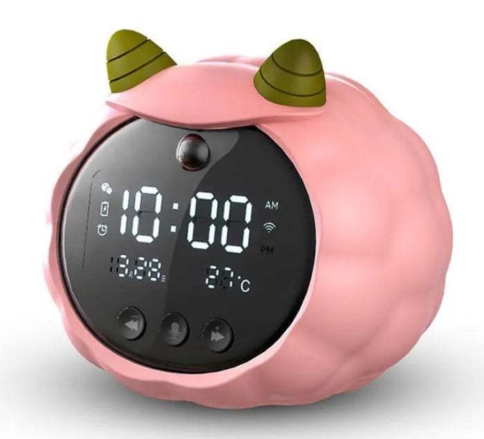 Silicone smart alarm clock with voice control, human body sensor, and luminous display on a bedside table.