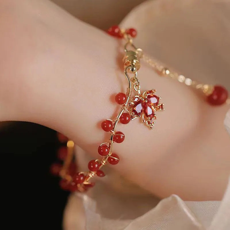 Red Chinese style magnetic bracelet with ginkgo leaf design and electroplated finish
