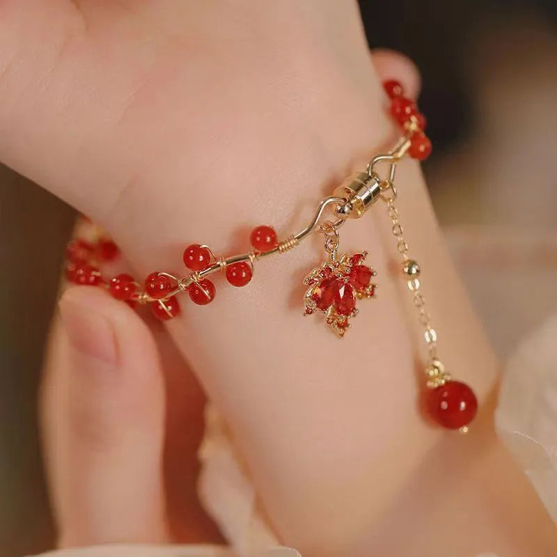 Red Chinese style magnetic bracelet with ginkgo leaf design and electroplated finish
