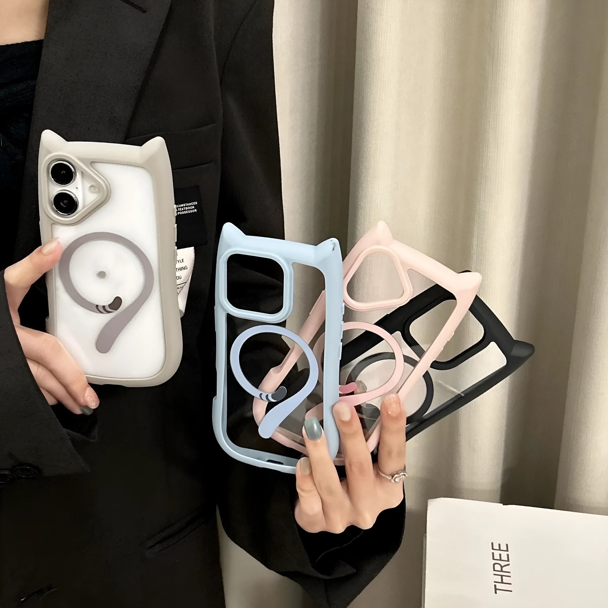 Transparent two-in-one acrylic and TPU phone case for iPhone 17 models on a table.