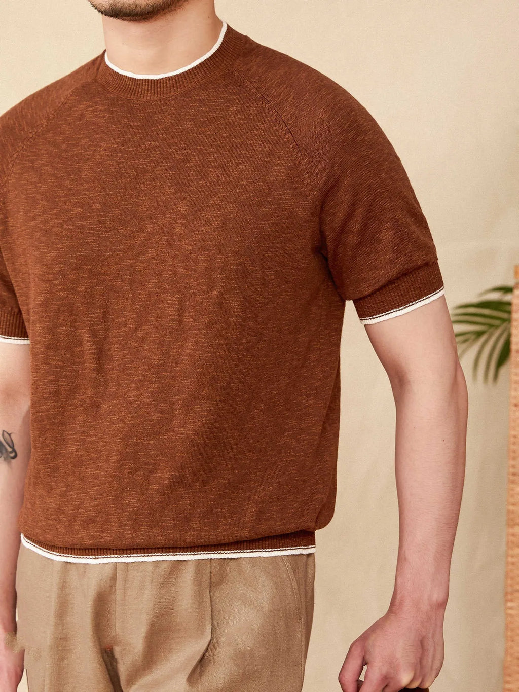 Brown linen cotton casual t-shirt with round neck and short sleeves laid flat