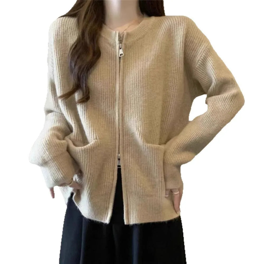 Beige viscose fibre long-sleeve sweater coat cardigan laid flat, showing soft drape and button front.