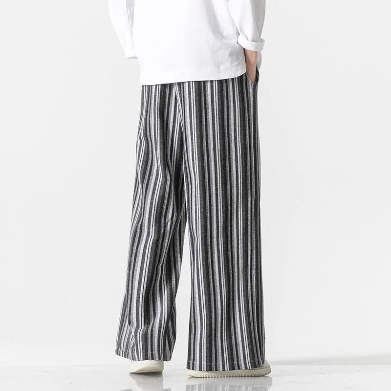 Man wearing vintage stripe loose straight leg cotton blend mopping pants in khaki colour.