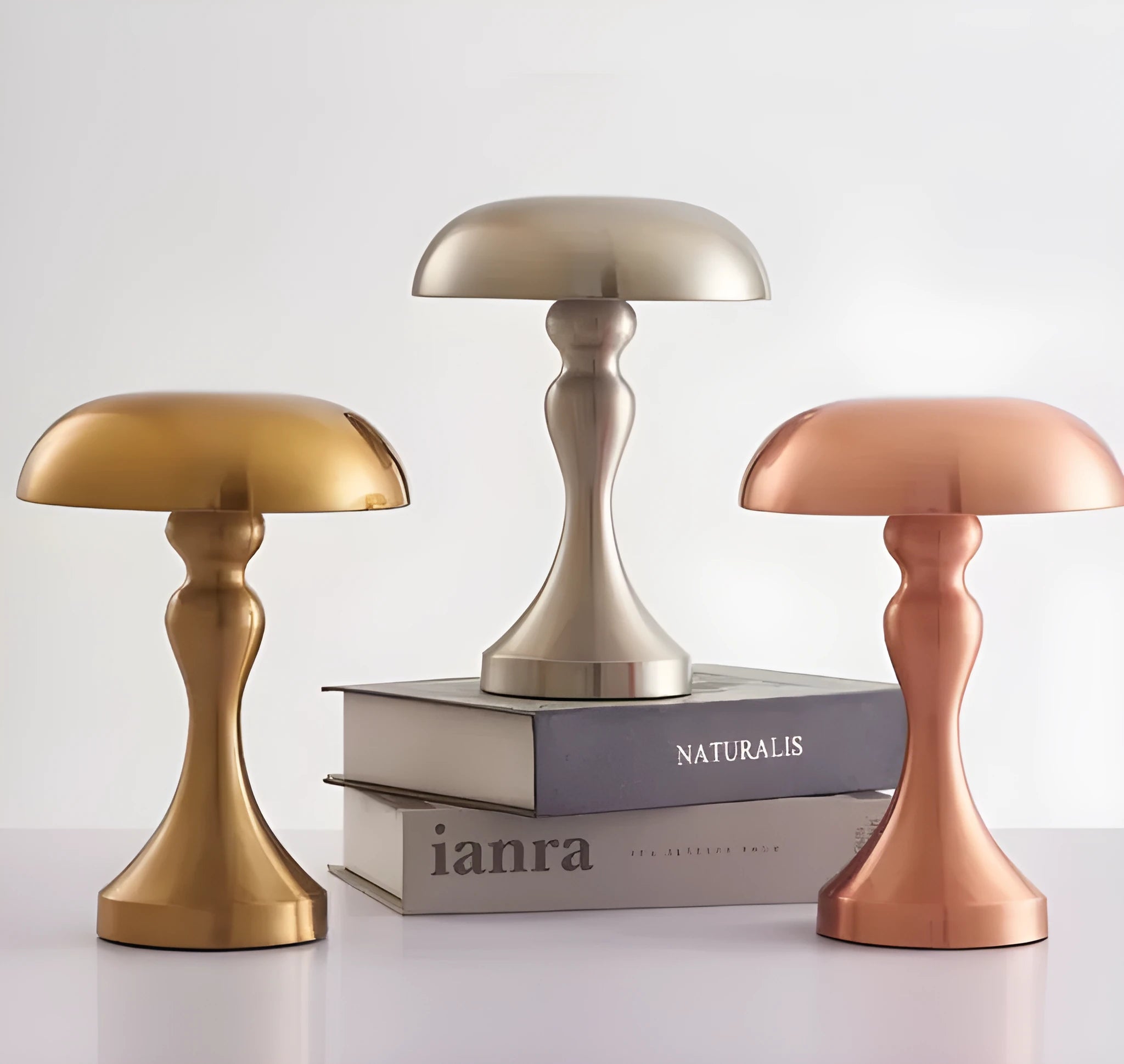 Metallic USB rechargeable LED desk lamp with touch control in bronze, gold, or silver finish.