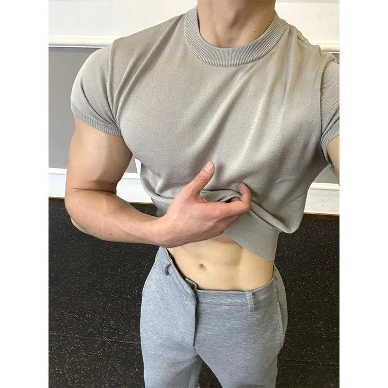 Men's slim fit short sleeve polyester T-shirt showing cuff-closing thread detail in solid colour option.