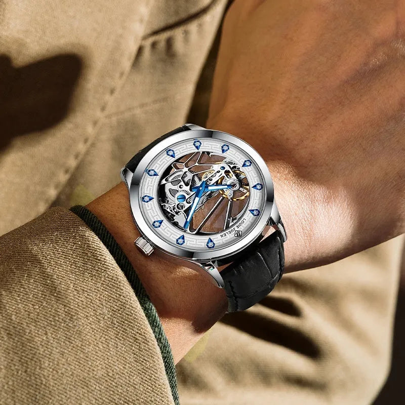 Men's silver case mechanical watch with white dial, blue hands, black leather strap, and luminous markings