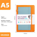 No-date notebook with PU cover and elastic strap in a choice of colours, lying open on a table.