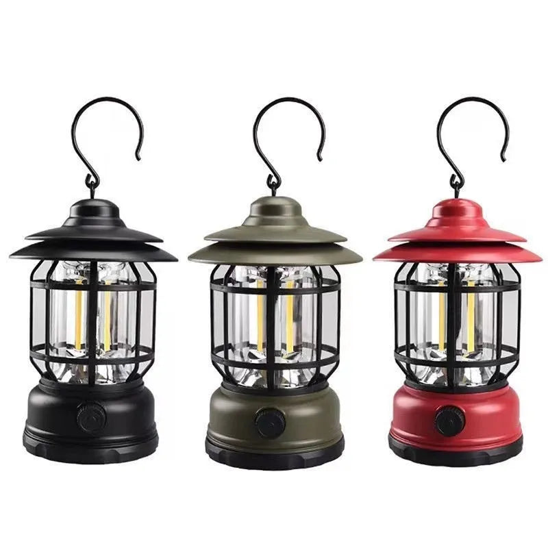 Portable camping lantern in dark green, black, or red colours, showing compact size with battery compartment.