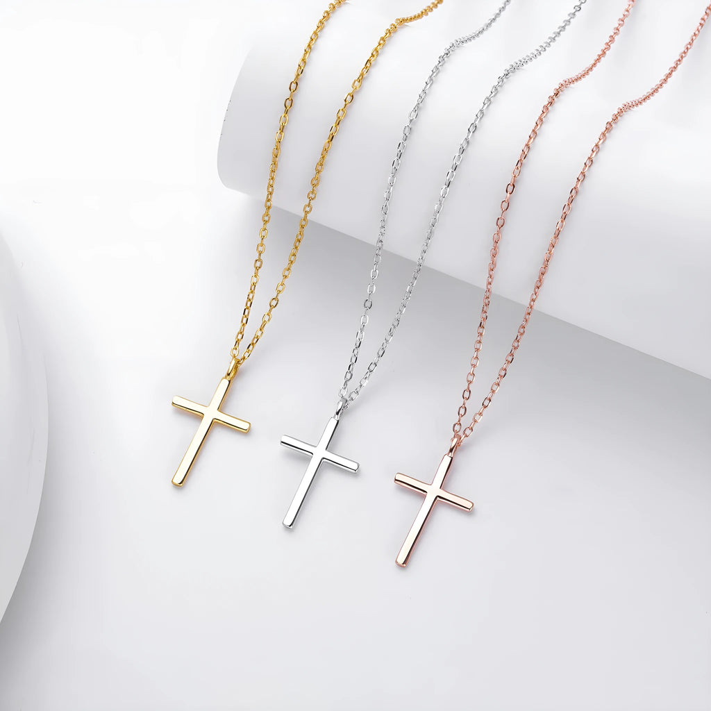 Sterling silver necklace with cross pendant on O-shaped chain showing gold electroplated finish