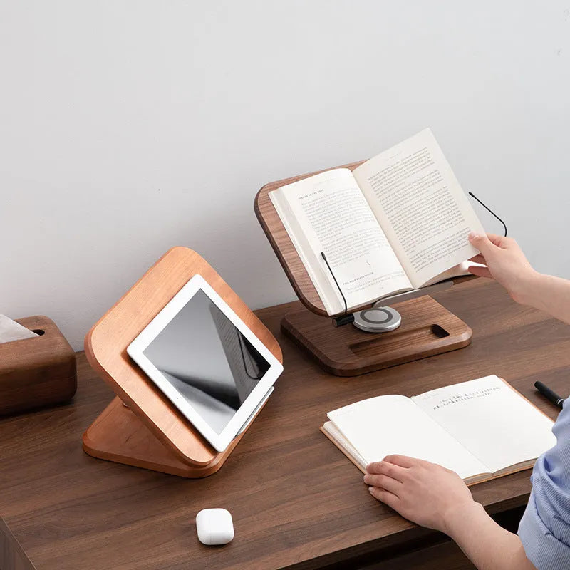 Solid wood adjustable reading rack in walnut colour holding a book on a table.