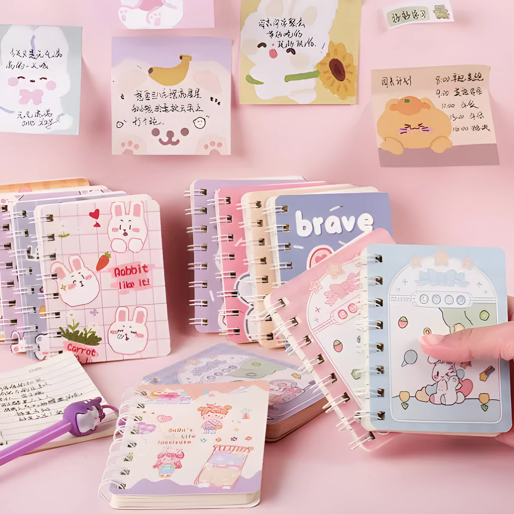 Flip Student Coil Book pocket notebook with cloth cover, shown open, measuring 105mm by 80mm.