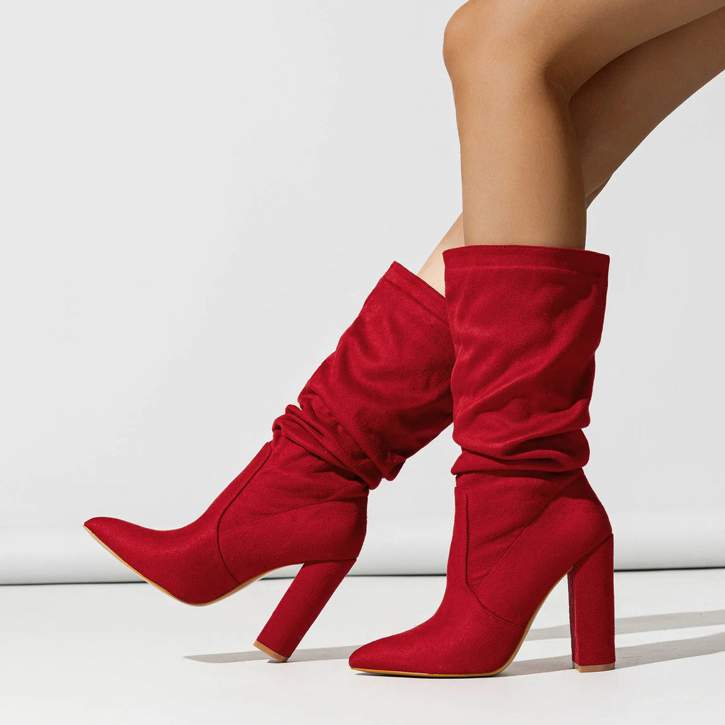 Women's black suede chunky heel pointed toe boots with a mid-calf length.