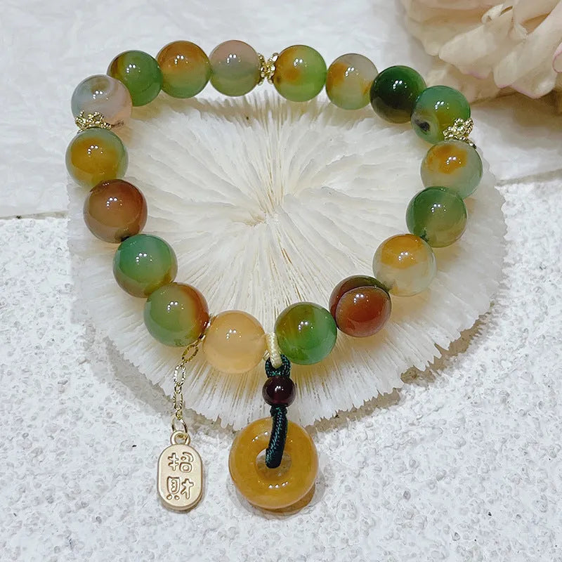 Yellow gold tone peacock agate and old mine topaz bracelet with peace buckle closure